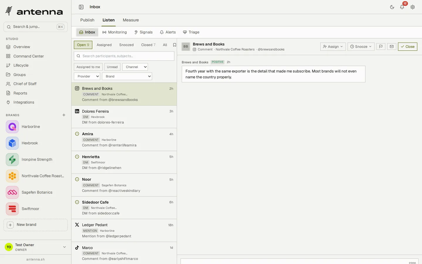 Antenna's unified inbox: nine open threads — Instagram comments, LinkedIn and TikTok direct messages, an X mention — arriving from Northvale Coffee Roasters, Hexbrook, Harborline, Swiftmoor and Sagefen Botanics, with a comment from @brewsandbooks selected, read as positive, and Assign, Snooze and Close controls above it